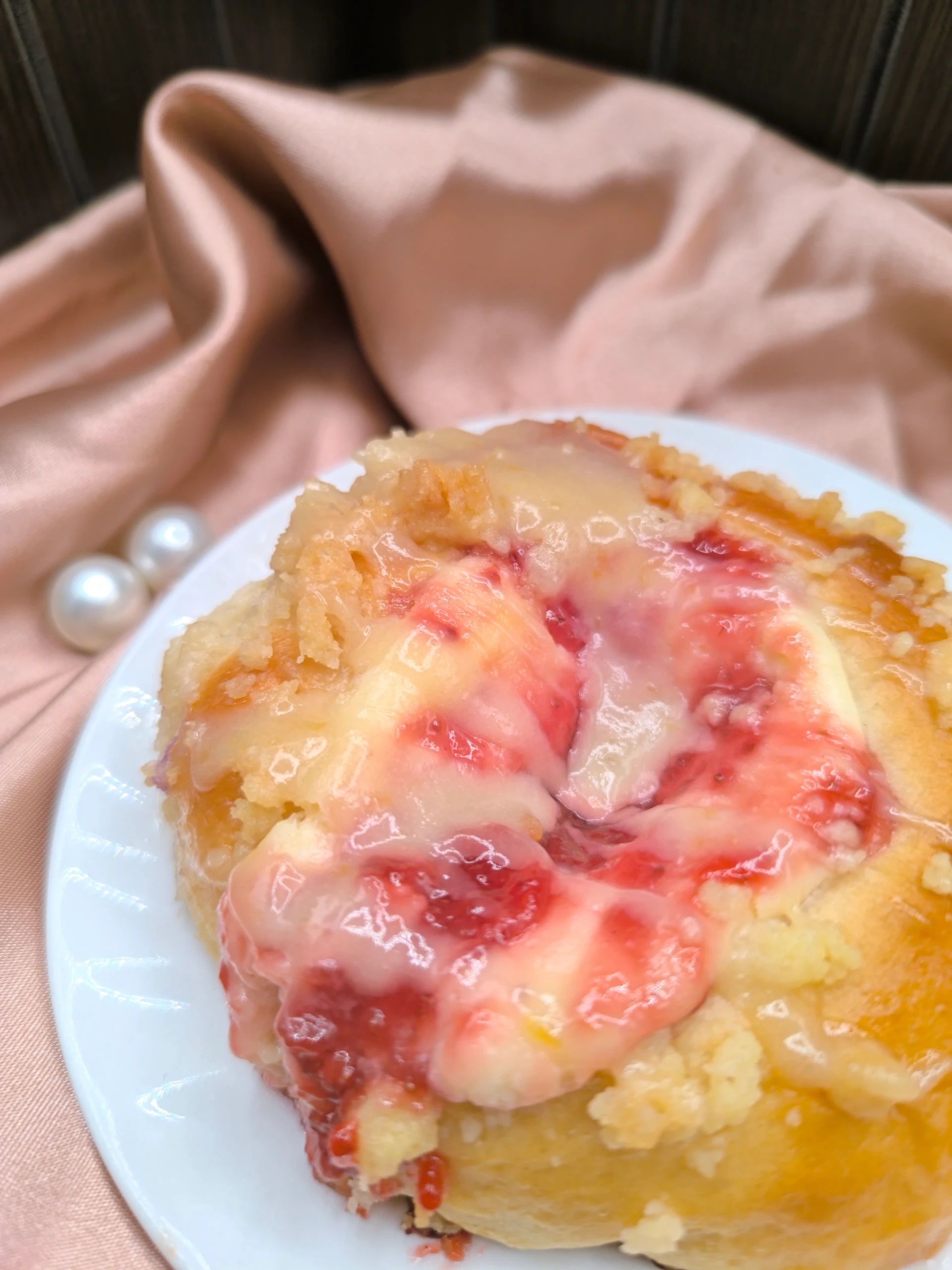Strawberry Delight Sinful Bun, soft milk bread swirled with strawberry jam and cream.