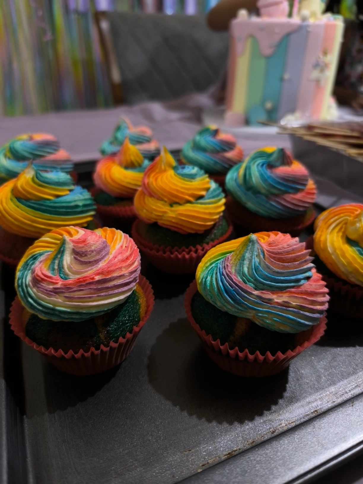 Unicorn Inspired Cupcake with Colorful cupcake base and rainbow ermine frosting for a unicorn themed birthday party