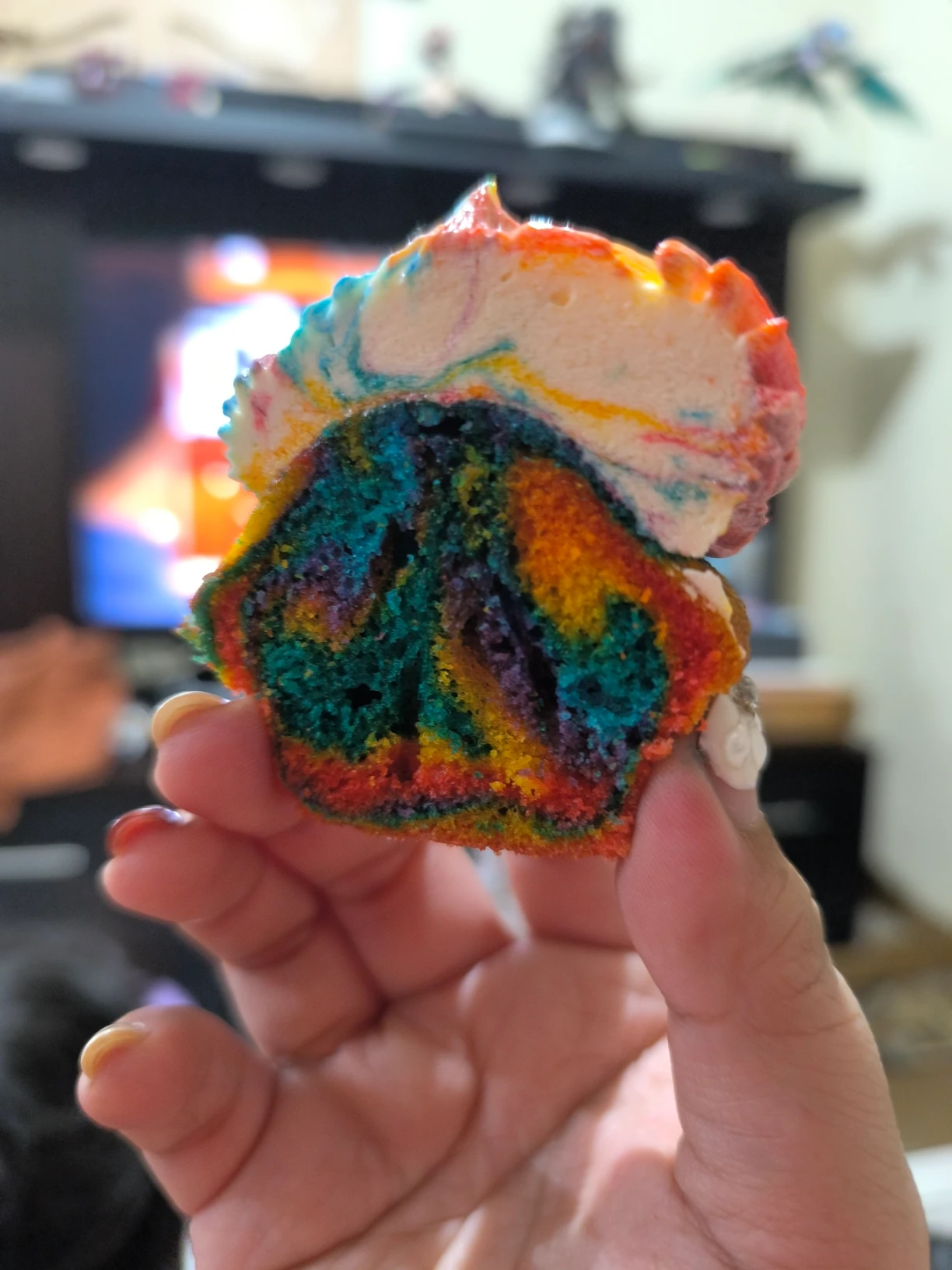 Unicorn Inspired Cupcake with Colorful cupcake base and rainbow ermine frosting
